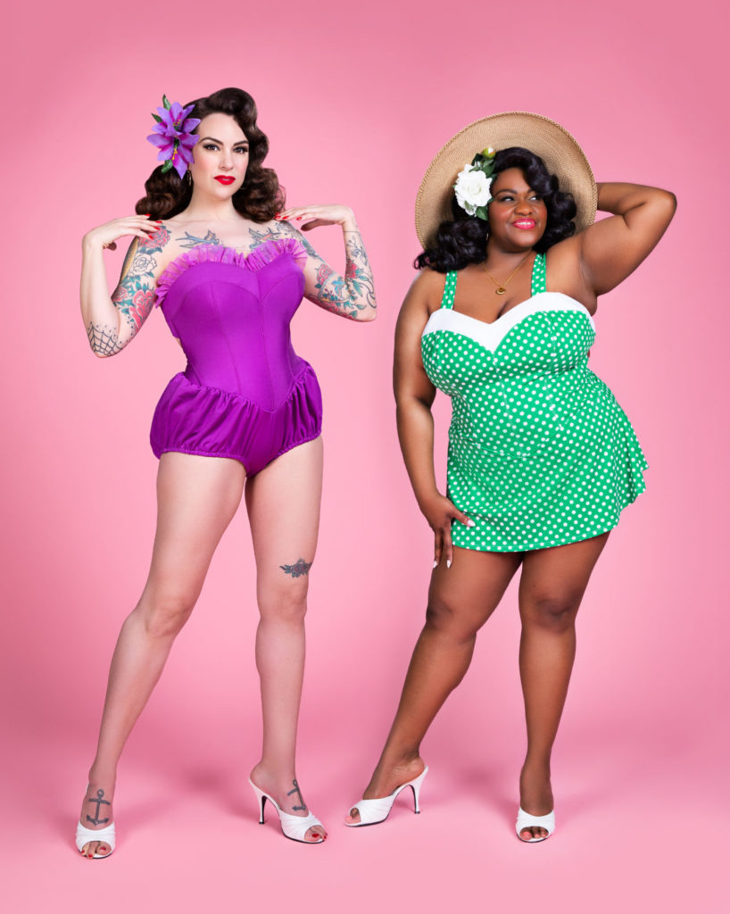 Two women in bathing suits posing