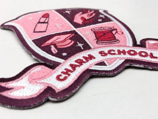 Charm School woven crest patch