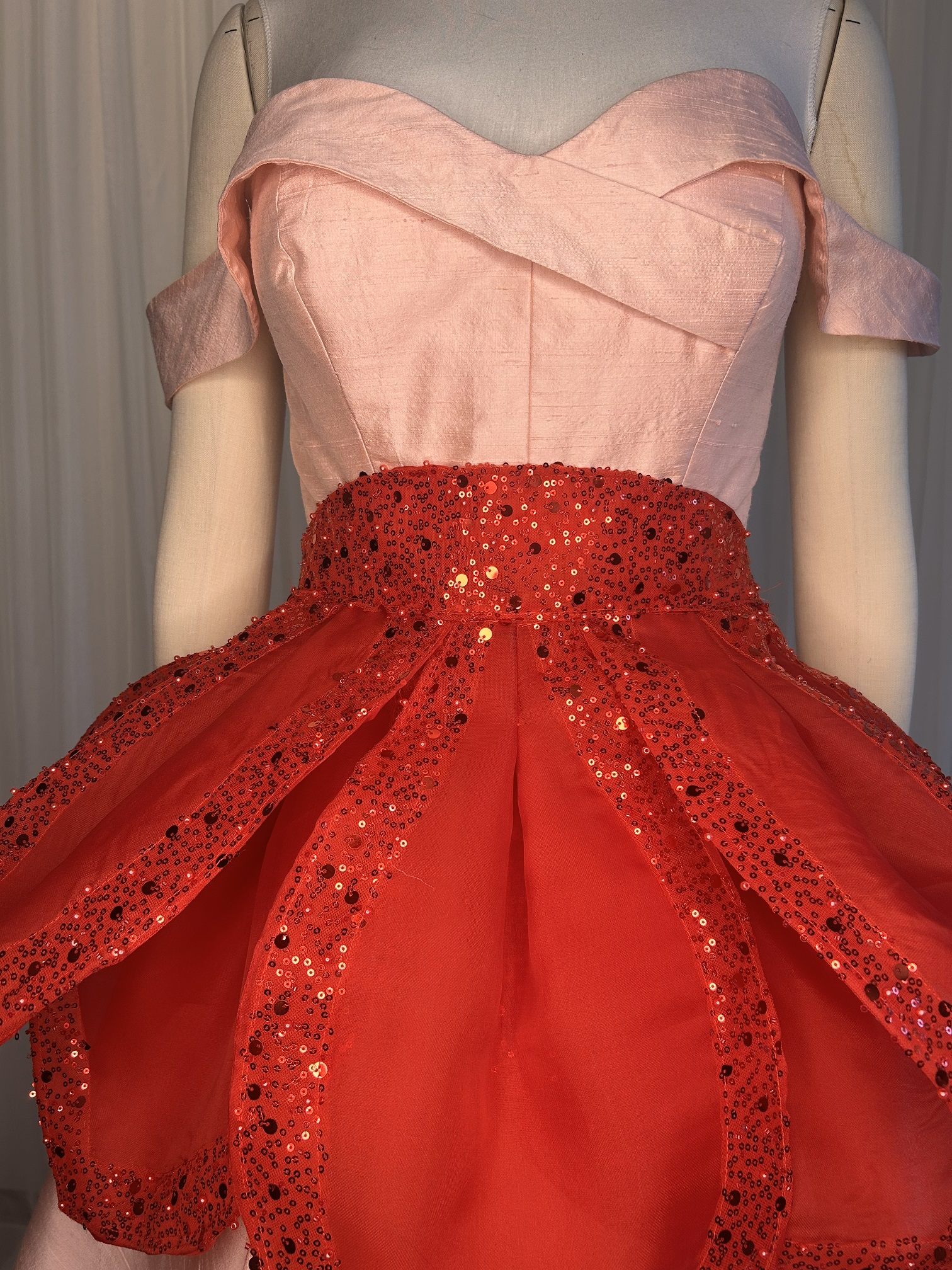 Charm Poinsettia Apron sewing pattern in red silk organza with beaded tulle