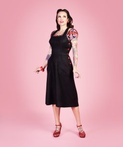 Gertie wearing the Make Do and Mend Overalls Dress with a floral Rita Blouse.