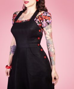 Gertie wearing the Make Do and Mend Overalls Dress with a floral Rita Blouse.