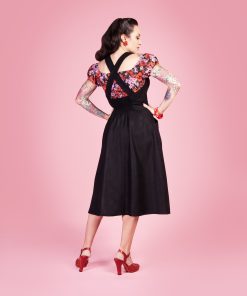 Gertie wearing the Make Do and Mend Overalls Dress with a floral Rita Blouse.