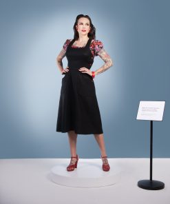 Gertie wearing the Make Do and Mend Overalls Dress with a floral Rita Blouse.