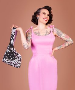 Gertie showing off the Charm Knot Bag sewing pattern.