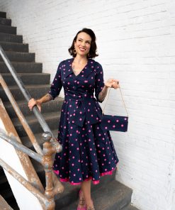 Gertie wearing the Charm Princess Coatdress with the Charm Envelope Clutch
