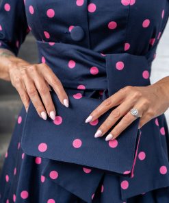 Gertie wearing the Charm Princess Coatdress with the Charm Envelope Clutch.