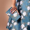 Susie wearing the Charm Princess Coatdress with the Charm Envelope Clutch.