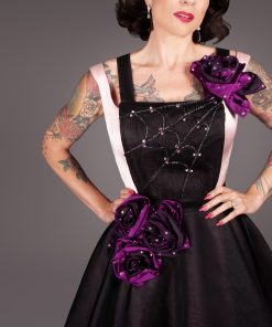 Gertie wearing the Deadly Roses Apron, a free sewing pattern from Charm Patterns