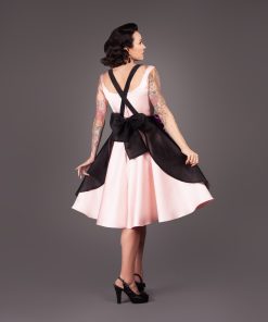 Gertie wearing the Deadly Roses Apron, a free sewing pattern from Charm Patterns